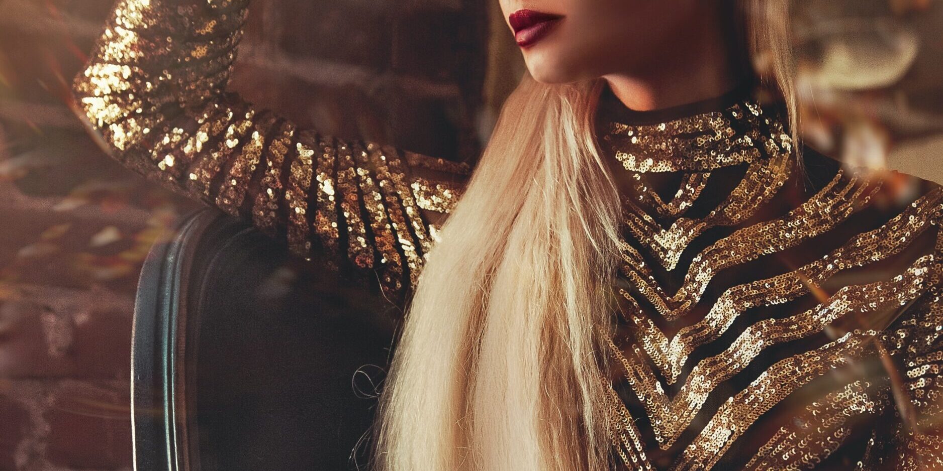 Photo by Alice Alinari women's gold long-sleeved dress